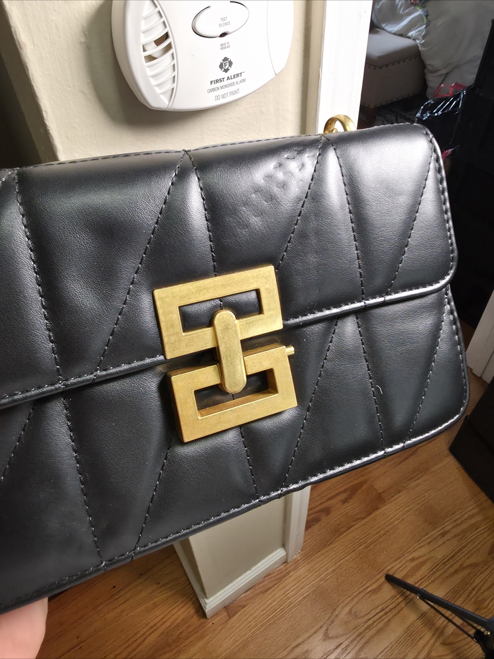 Quilted Black Leather Shoulder Bag with Gold Buckle